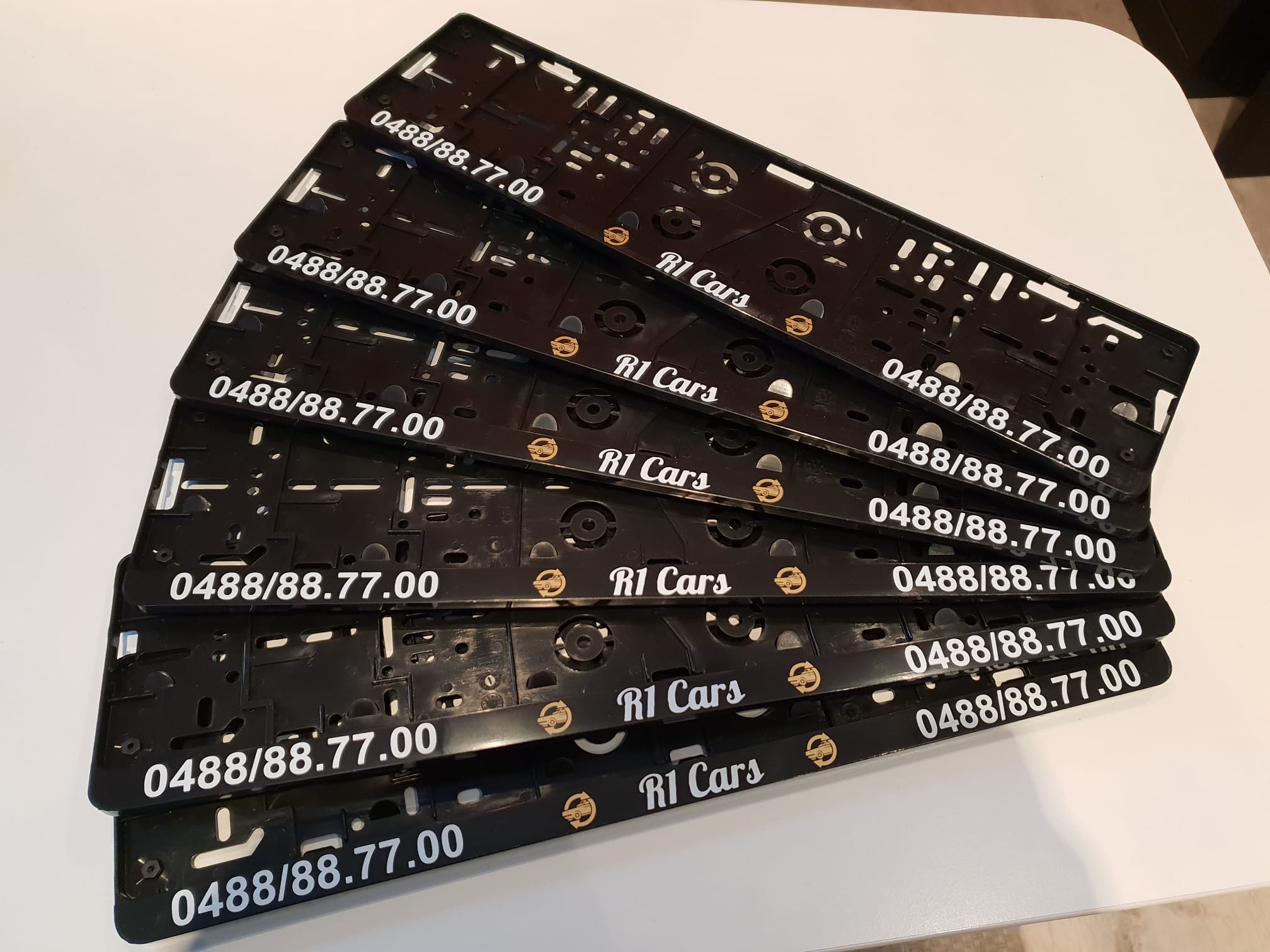 R1 Cars branded licence plate holders with phone 0488/88.77.00