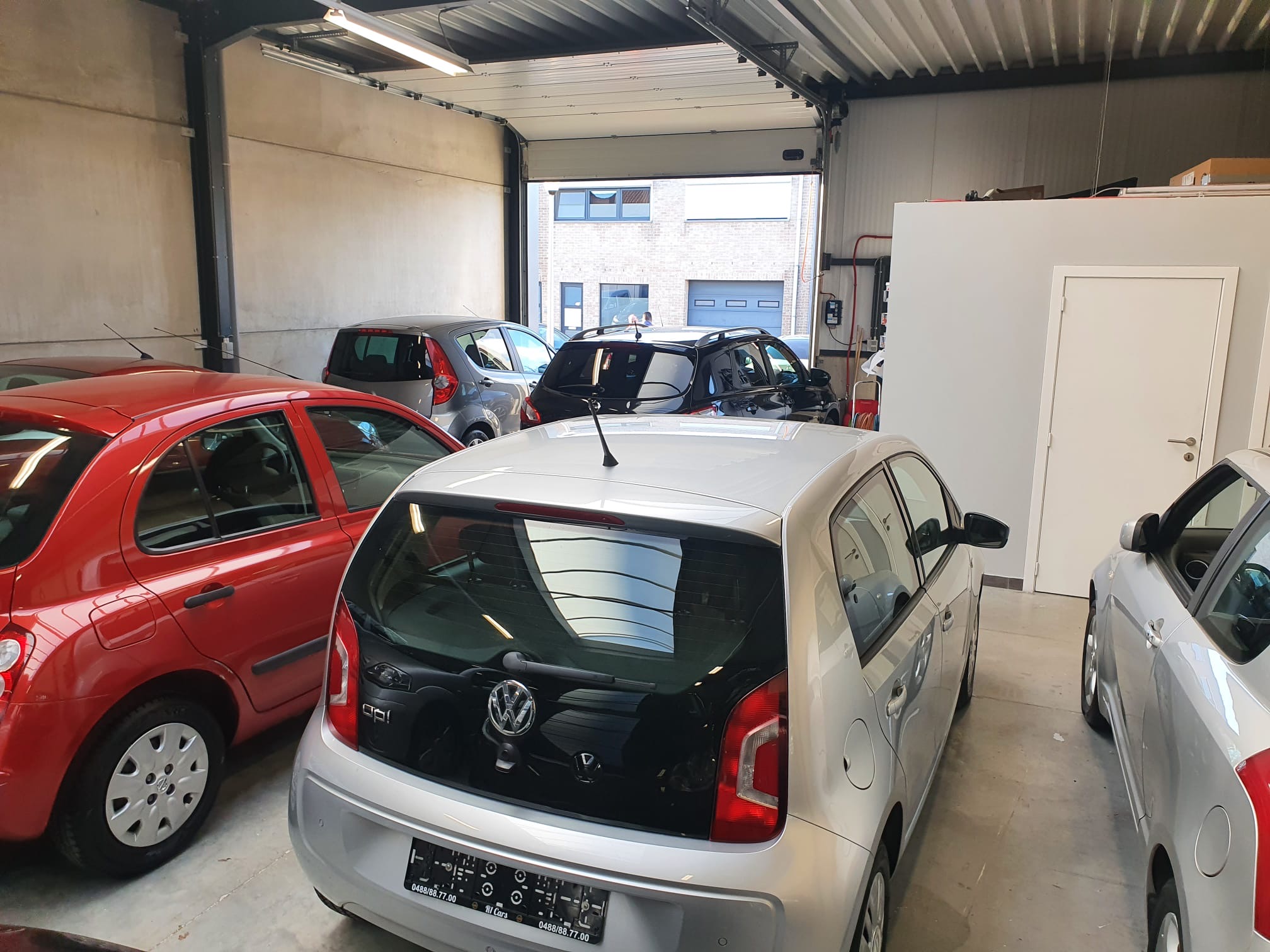 Inside the R1 Cars garage with compact cars